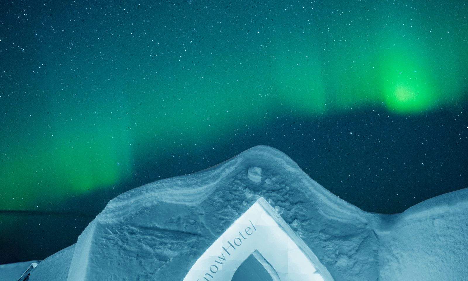 Northern lights above Arctic SnowHotel & Glass igloos