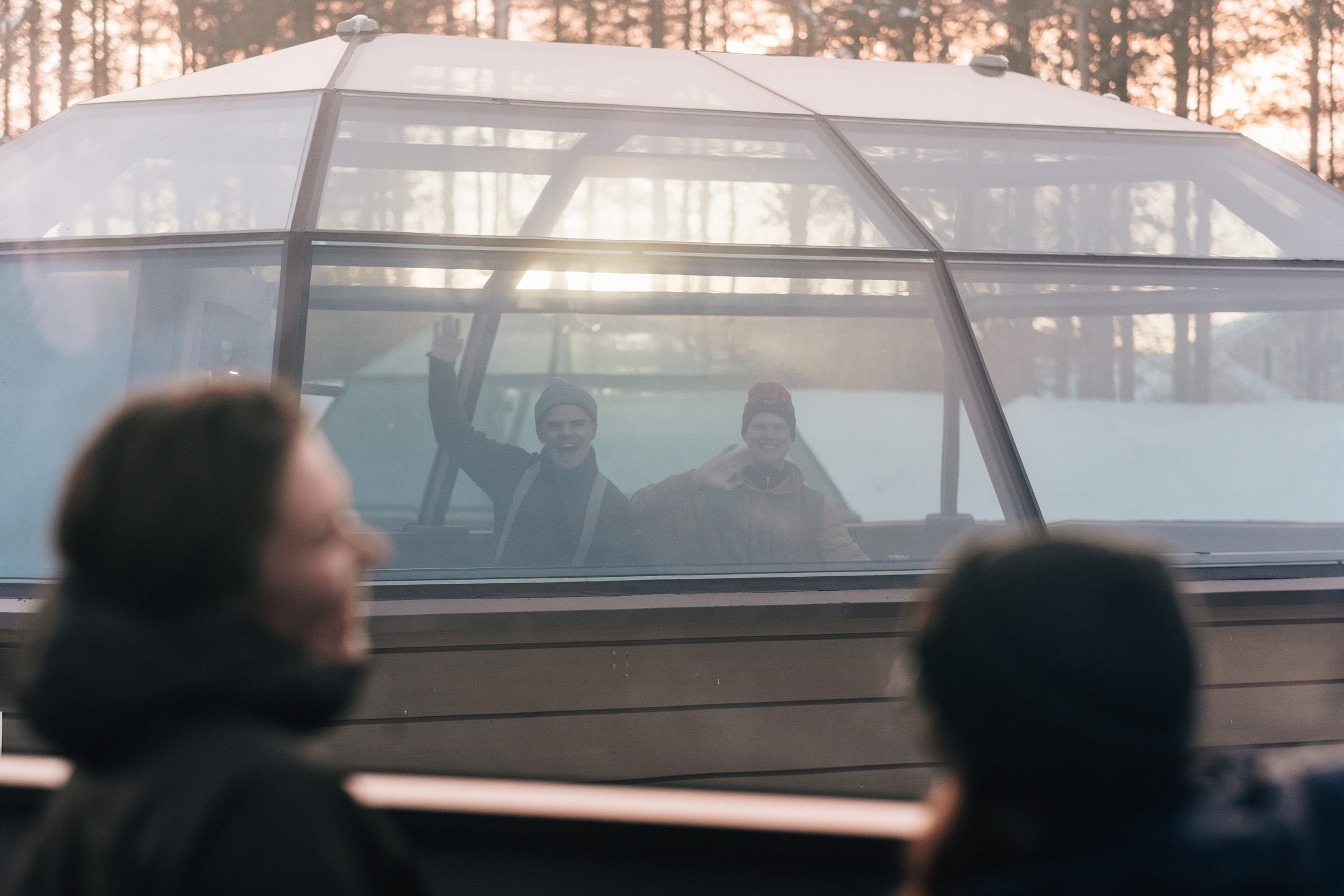People in the glass igloos