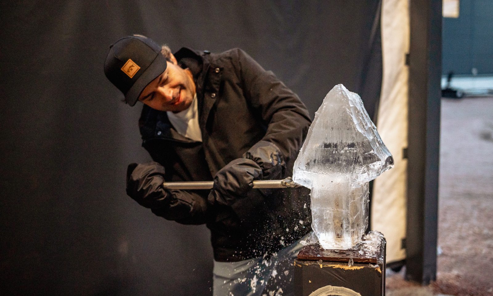A man doing an ice sculpture