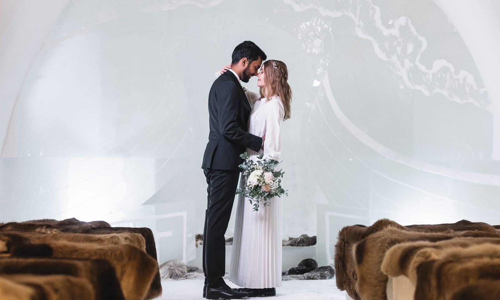 Winter wedding in Ice chapel at the Arctic snowhotel in Rovaniemi Lapland