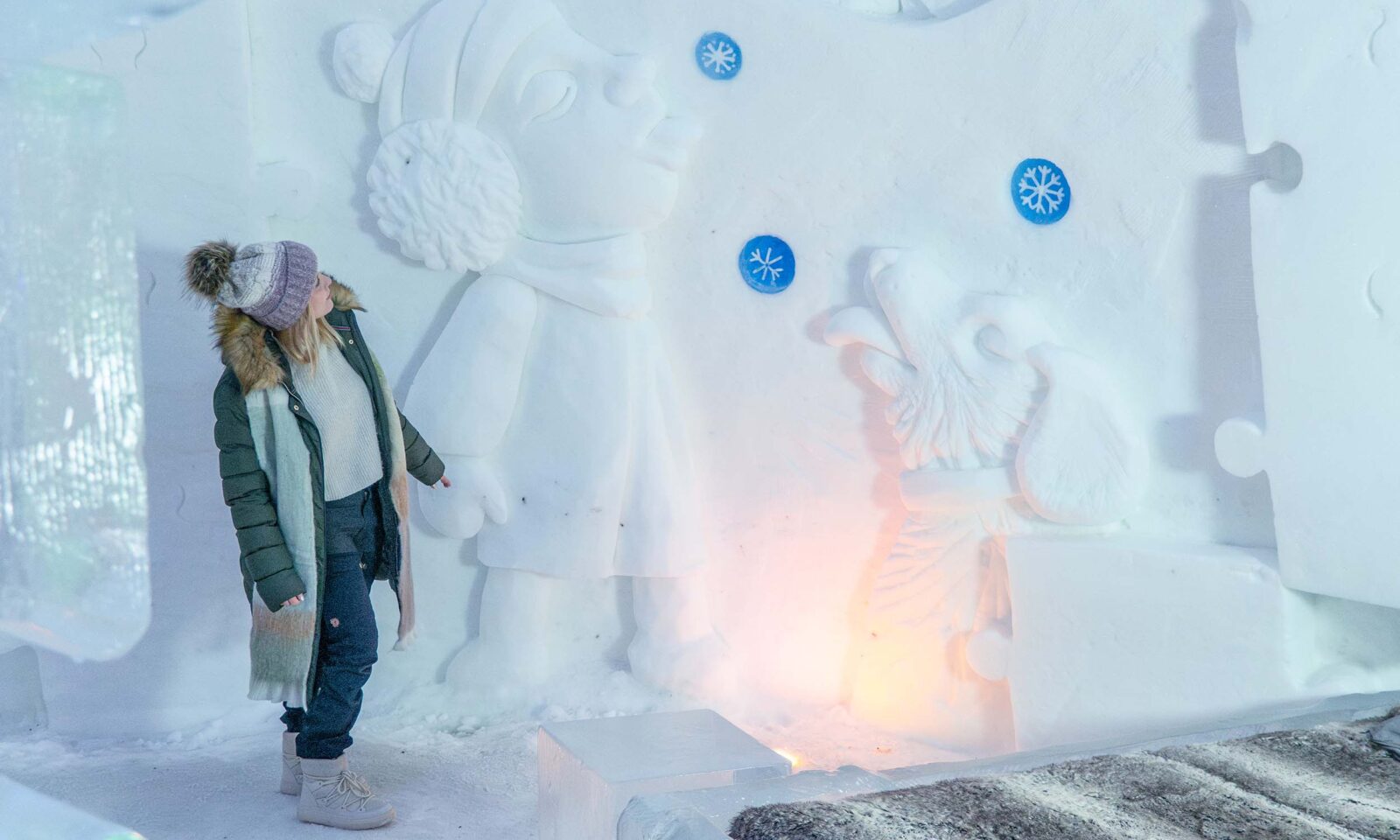 Visitor admiring snow art