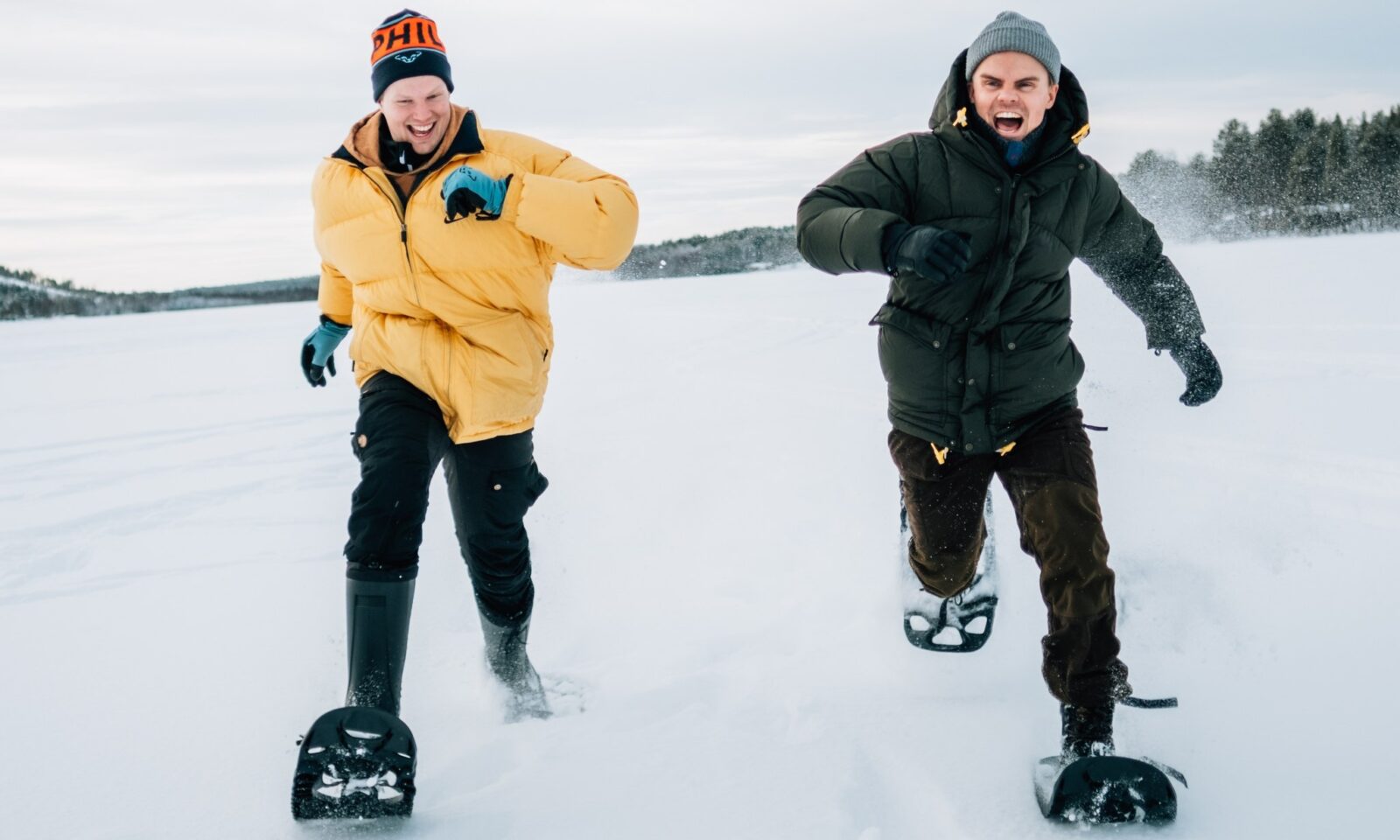 Two men in snow shoeing scenic excursion