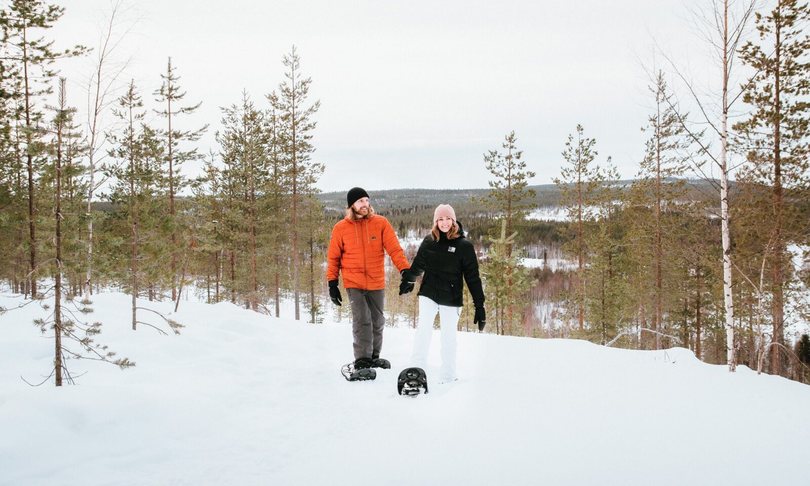 A couple in snowshoeing scenic excursion