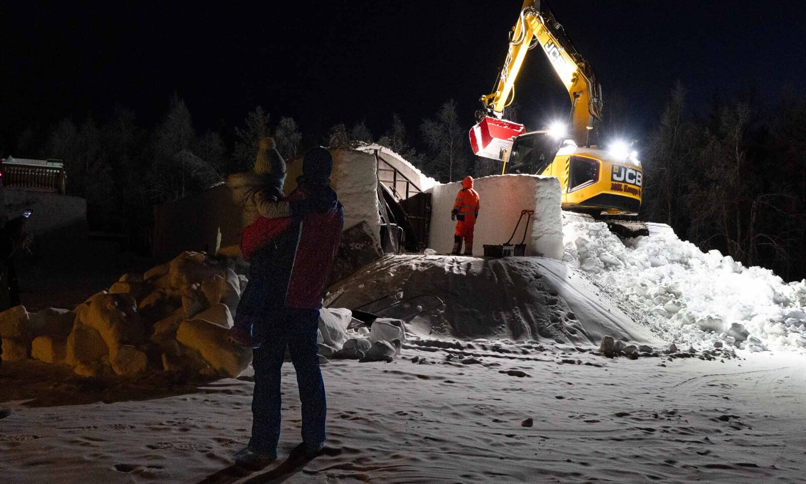 Guests watching snow building in early winter